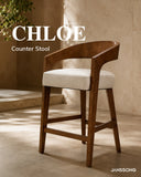 JANSSONG CHLOE counter stool with curved backrest and cream upholstered seat
