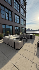 Customer photo of JANSSONG lounge and dining furniture on a terrace overlooking the water
