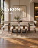 JANSSONG BARON dining table with cream upholstered chairs in a warm neutral interior